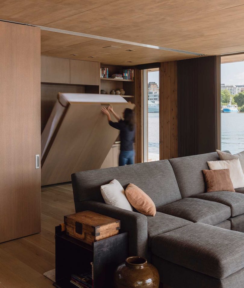 modern interior of floating cabin on water with murphy bed