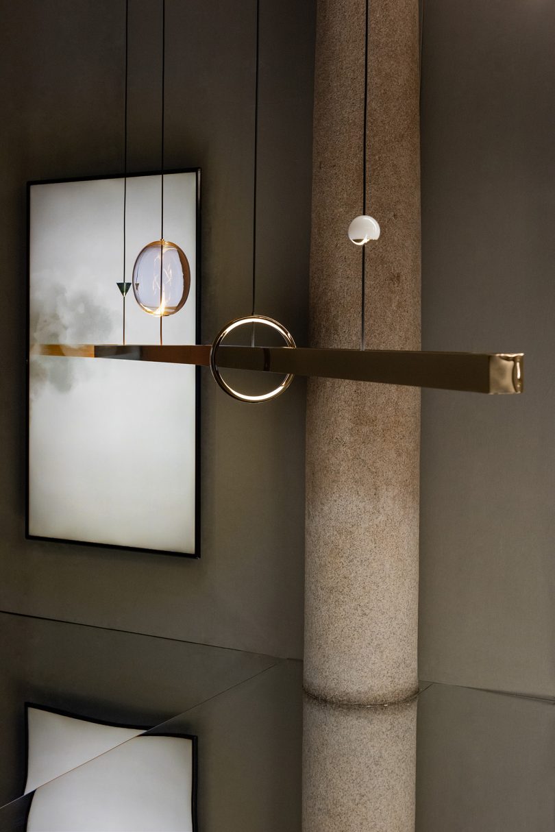 light fixture exhibit inside marble and stone space