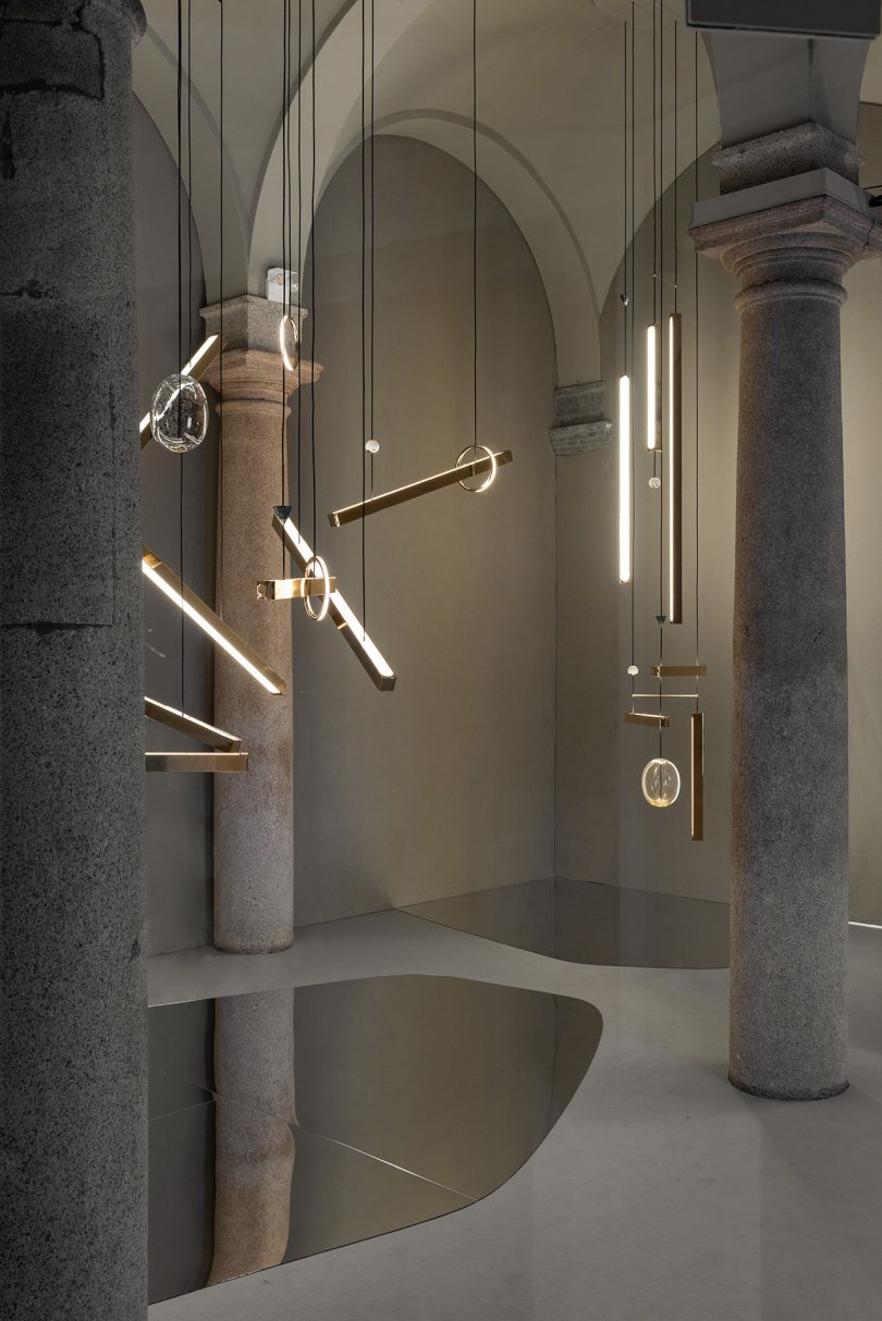 light fixture exhibit inside marble and stone space