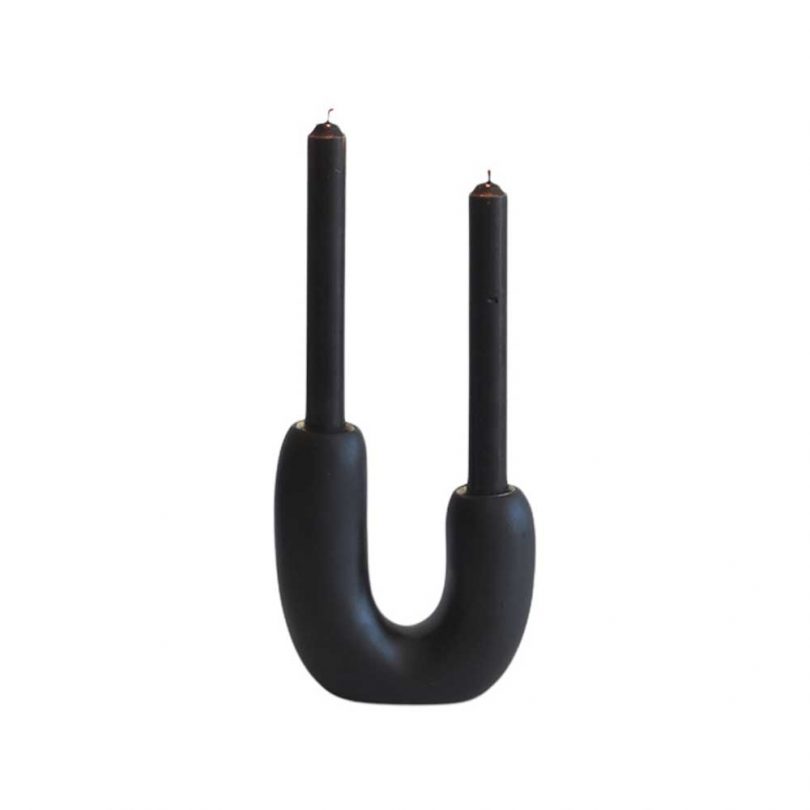 U-shaped black candleholder with black candles