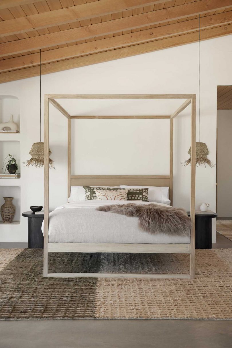 Modern bedroom with canopy bed and neutral textiles