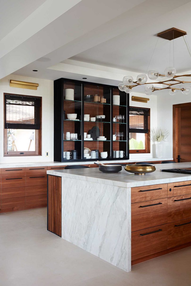 modern kitchen with wooden cabinets and marble countertops