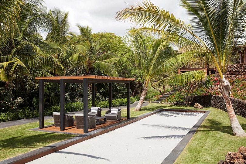 tropical yard with covered seating area