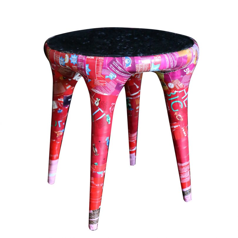 colorful collaged stool on white background