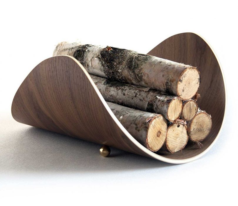 curved firewood holder holding firewood