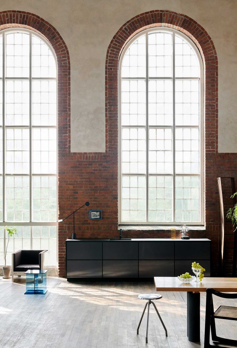 reflective black kitchen cabinets in apartment