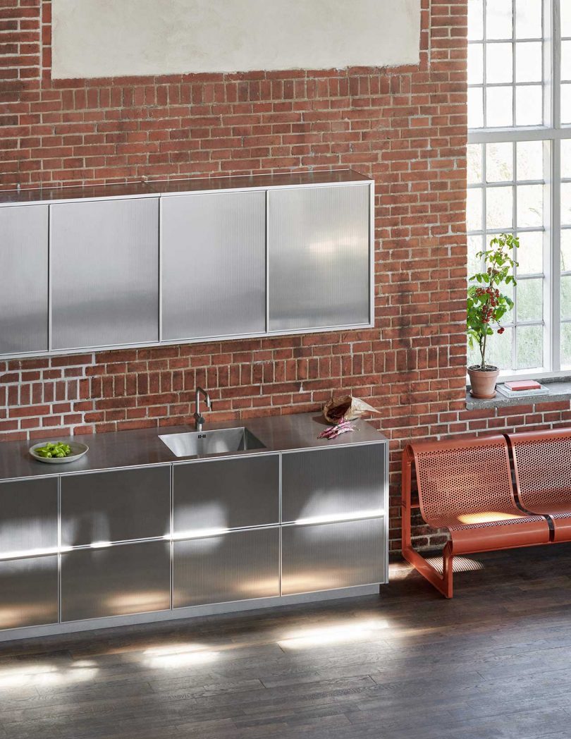 reflective kitchen cabinets in loft