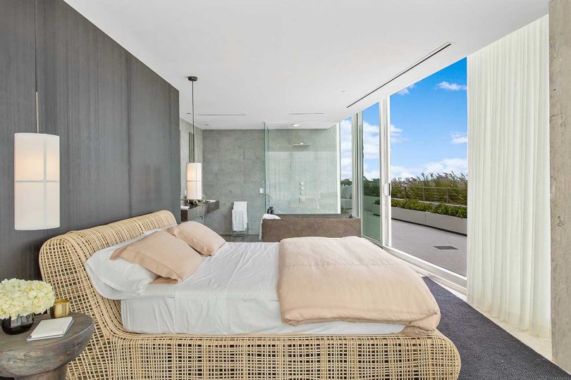 modern bedroom and open bathroom looking out to the rooftop terrace