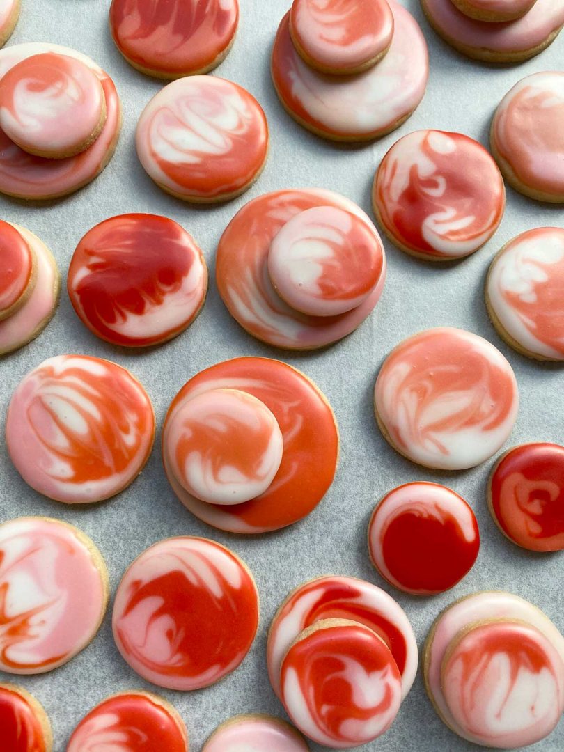 cookies with swirled red and white icing