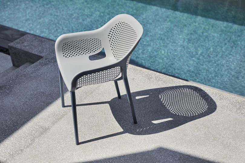 outdoor armchair next to pool
