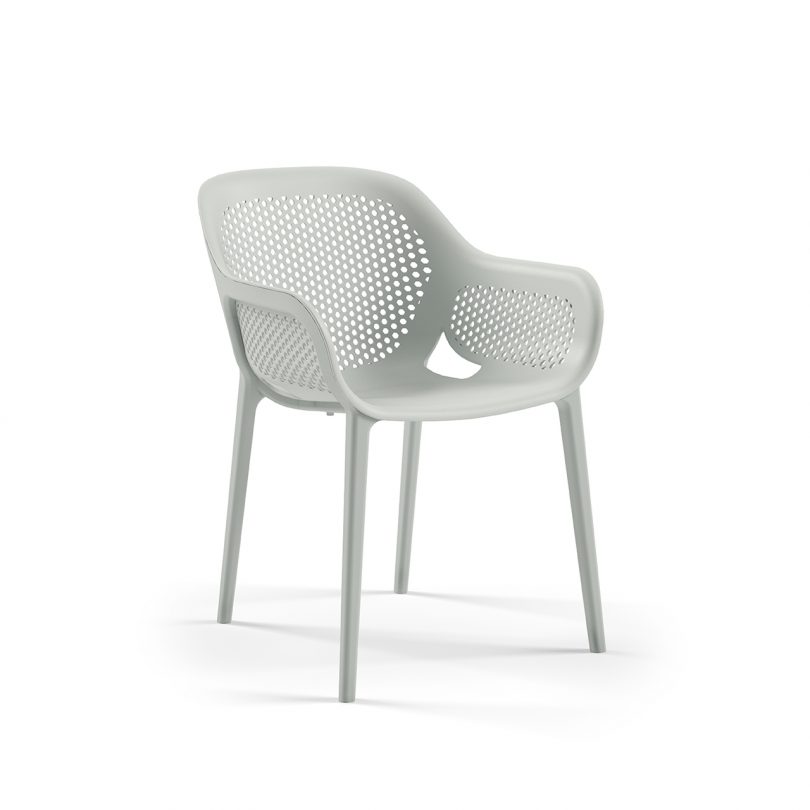 three quarter photo of light colored outdoor armchair on white background