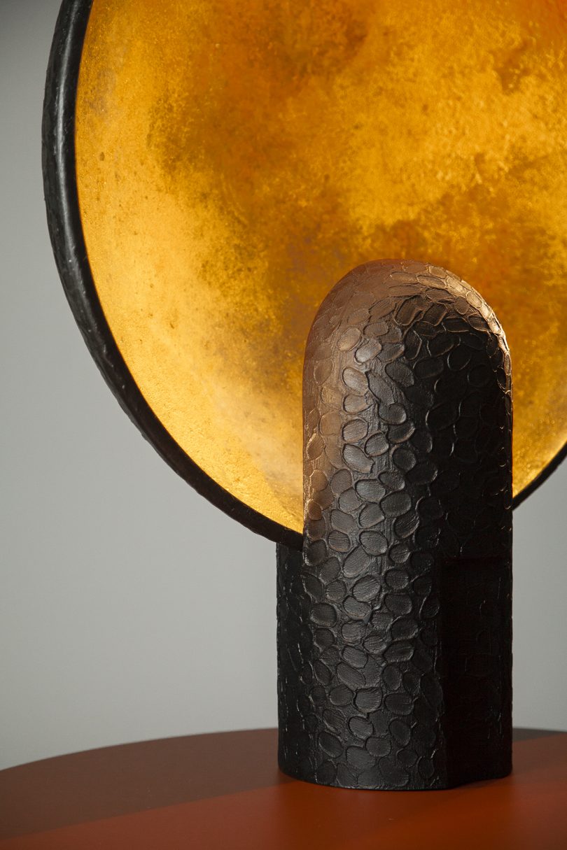 detail of black and gold wall lamp