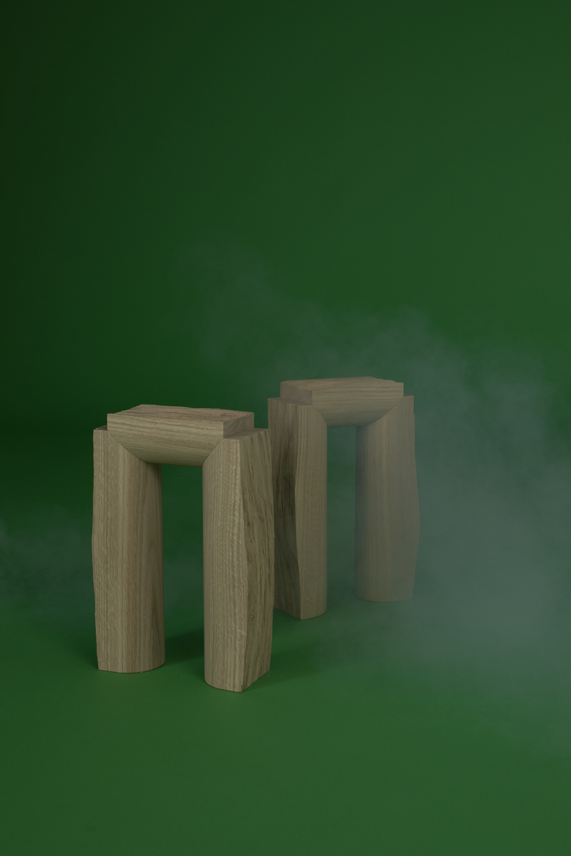 two tables on dark green background with white smoke