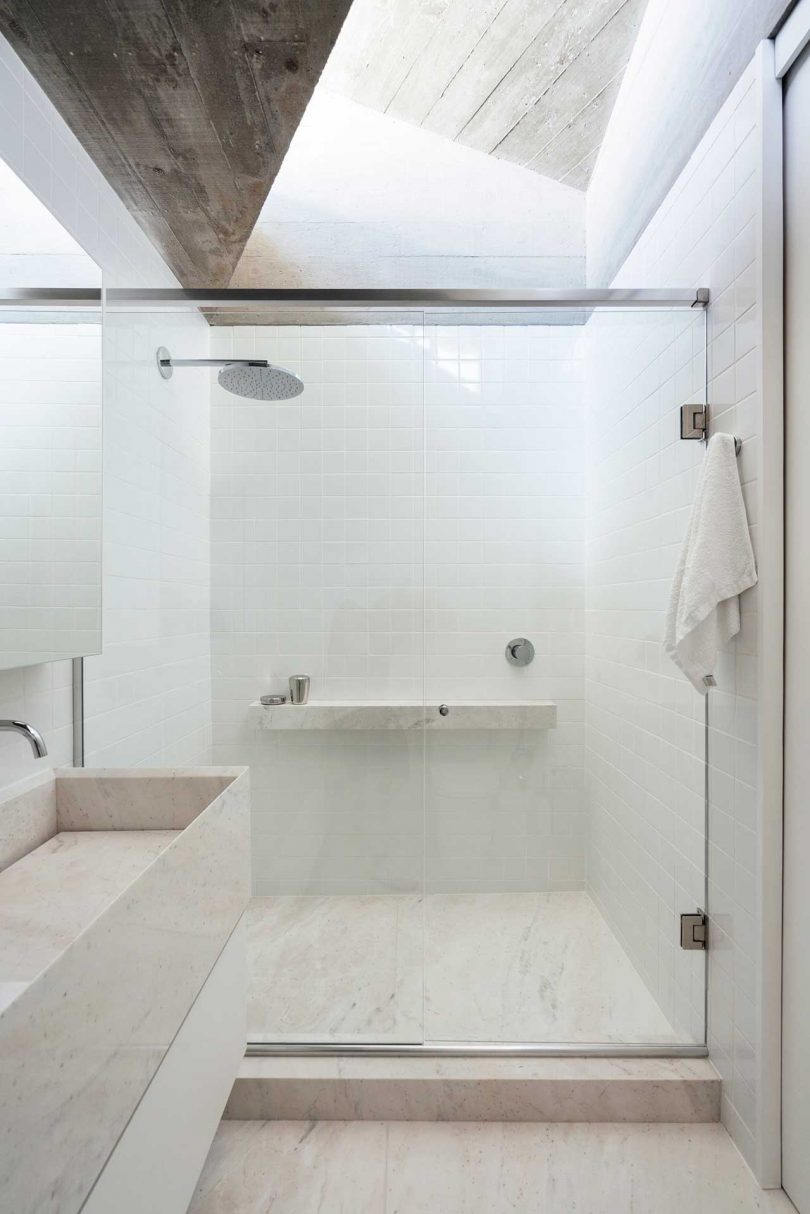 light-filled white bathroom in modern house