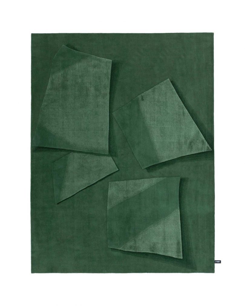 green floor rug with geometric shapes on white background