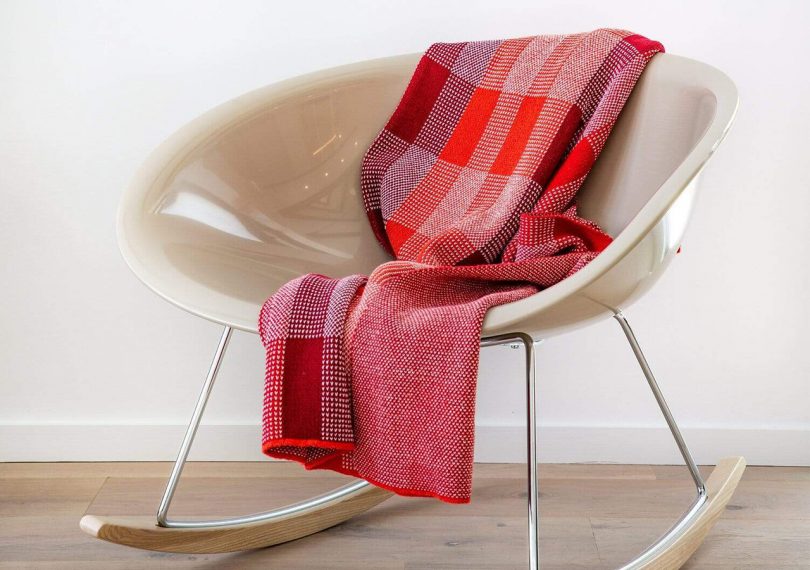 Kelly Harris Smith Buffalo Plaid Throw over a modern rocking chair