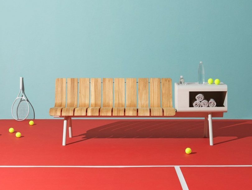 wood and aluminum outdoor bench and table on tennis court