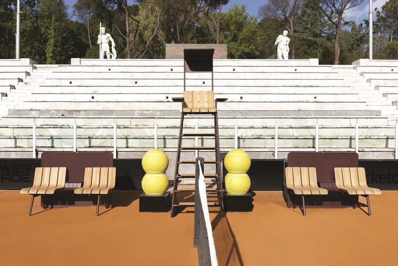 wood and aluminum outdoor furniture on tennis court in a stadium