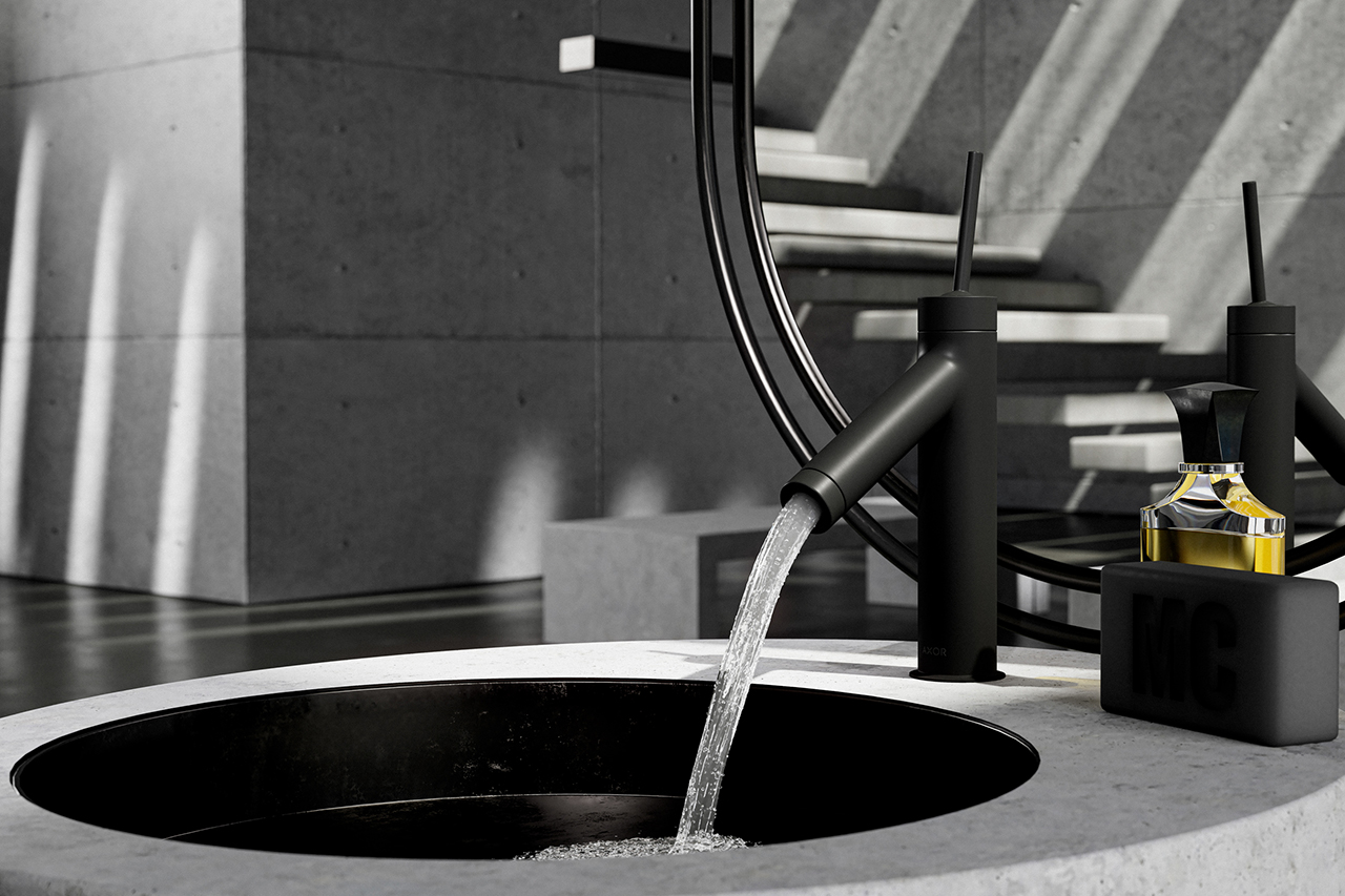 sleek black bathroom faucet turned on and flowing into a stone sink padstyle.com