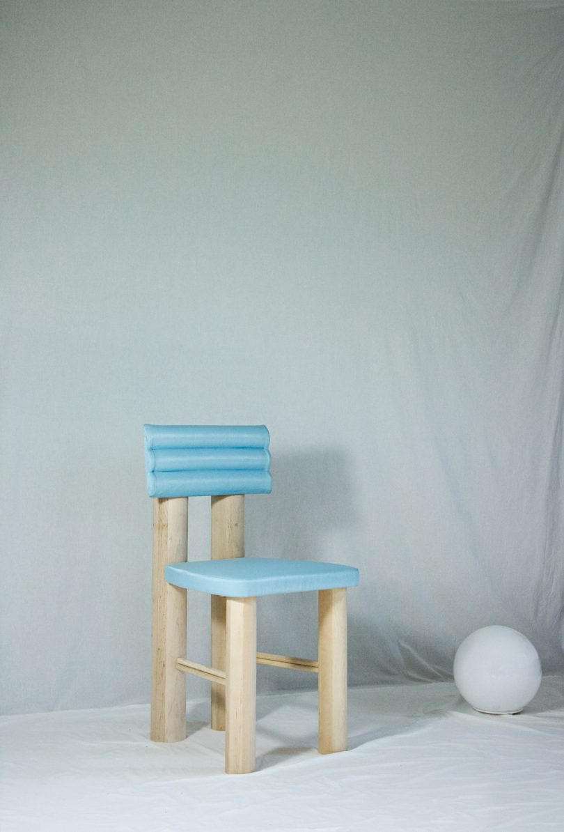wood chair with light blue upholstery