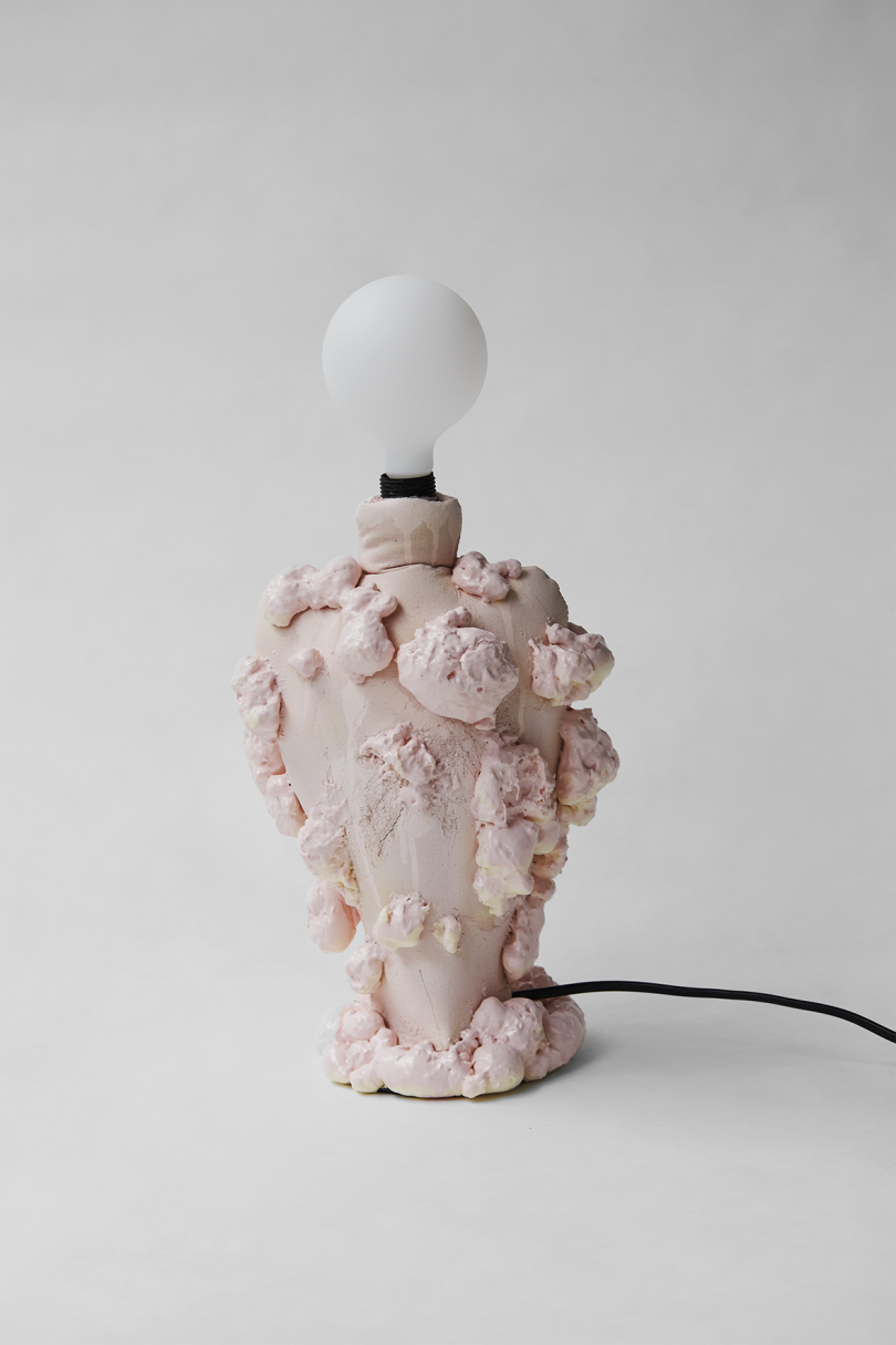abstract light pink lamp with bare bulb