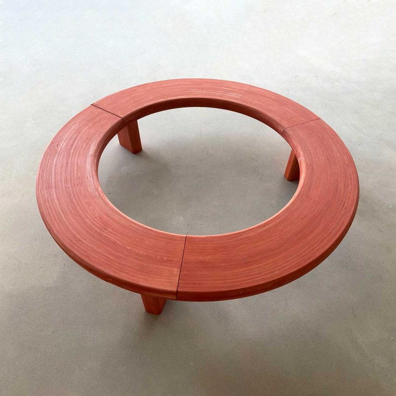 circular wooden bench painted red