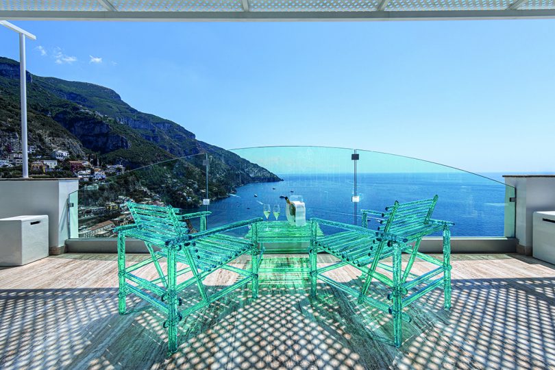 acrylic turquoise outdoor table and chairs overlooking the ocean