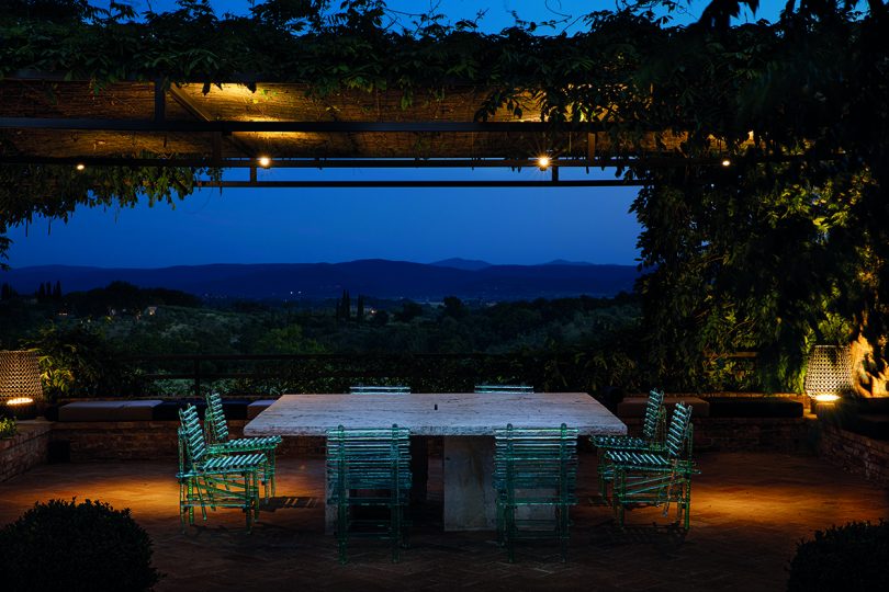 acrylic turquoise outdoor table and chairs outside at dusk