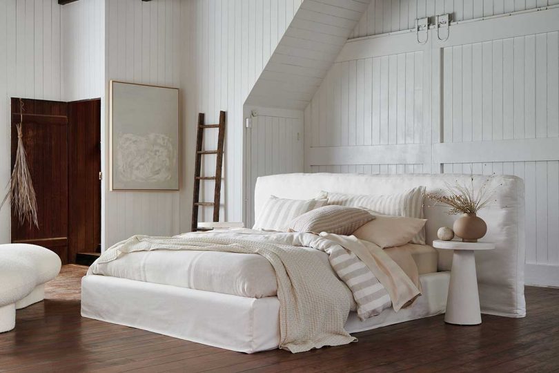 white bedroom with white upholstered bed