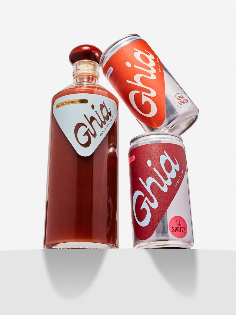 bottle and two cans of Ghia stacked on a white background