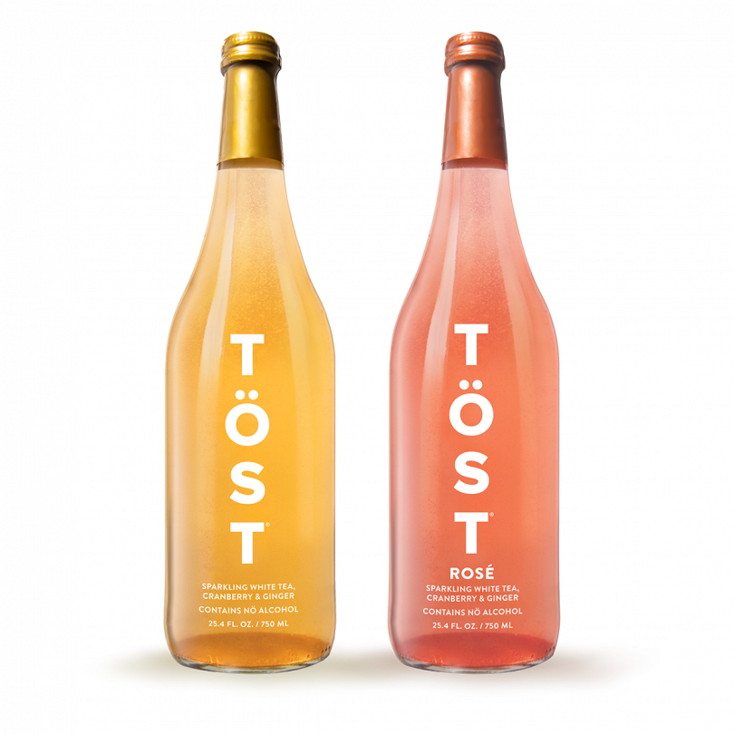 two bottles of TOST alcohol free wine on light background