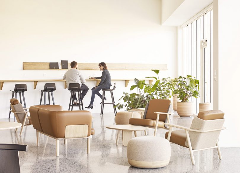 public space in light colors with two people and plenty of seating