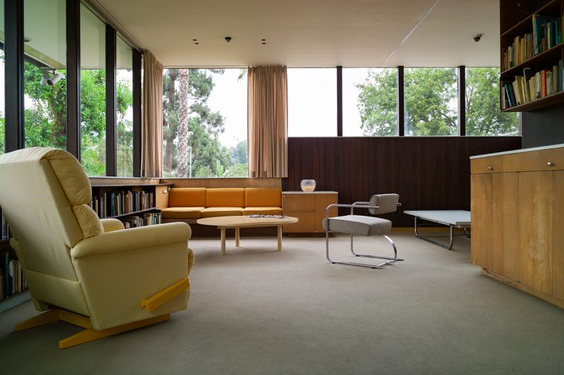 interior space with two chairs, sofa, coffee table, and windows
