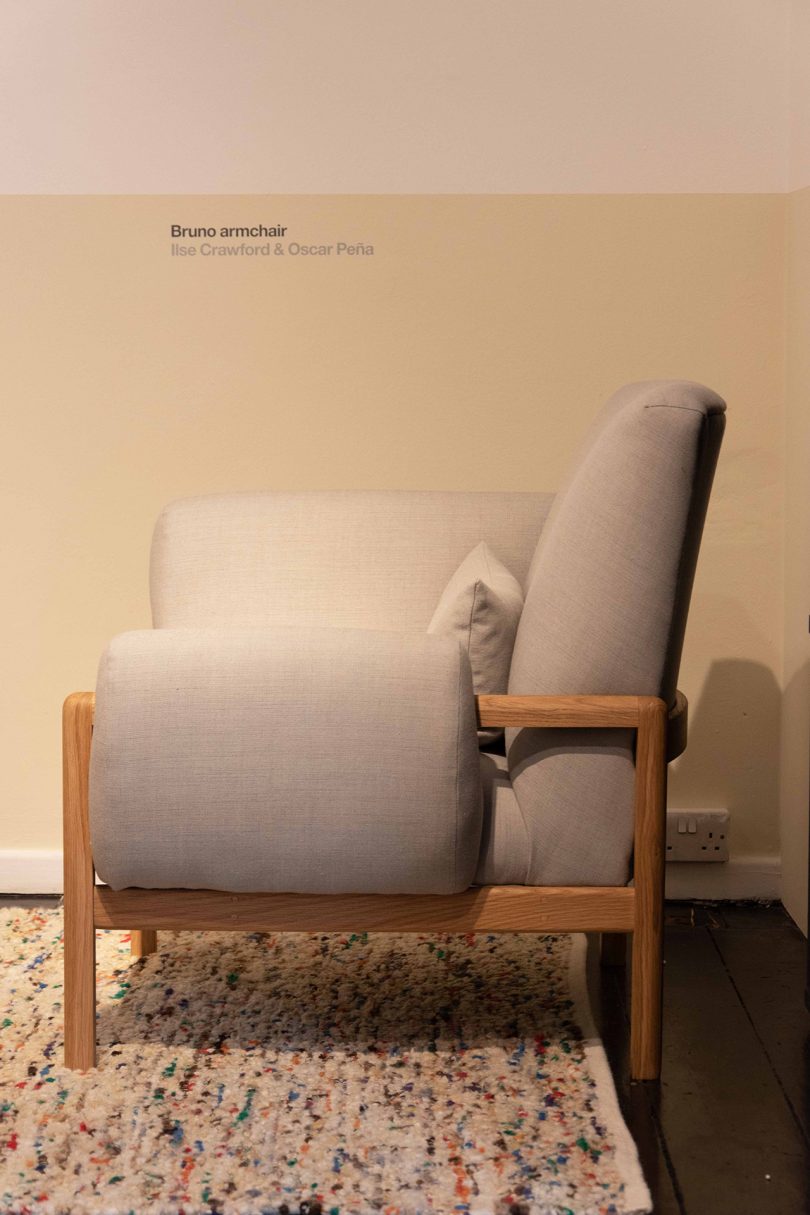 profile image of overstuffed light grey and wood armchair