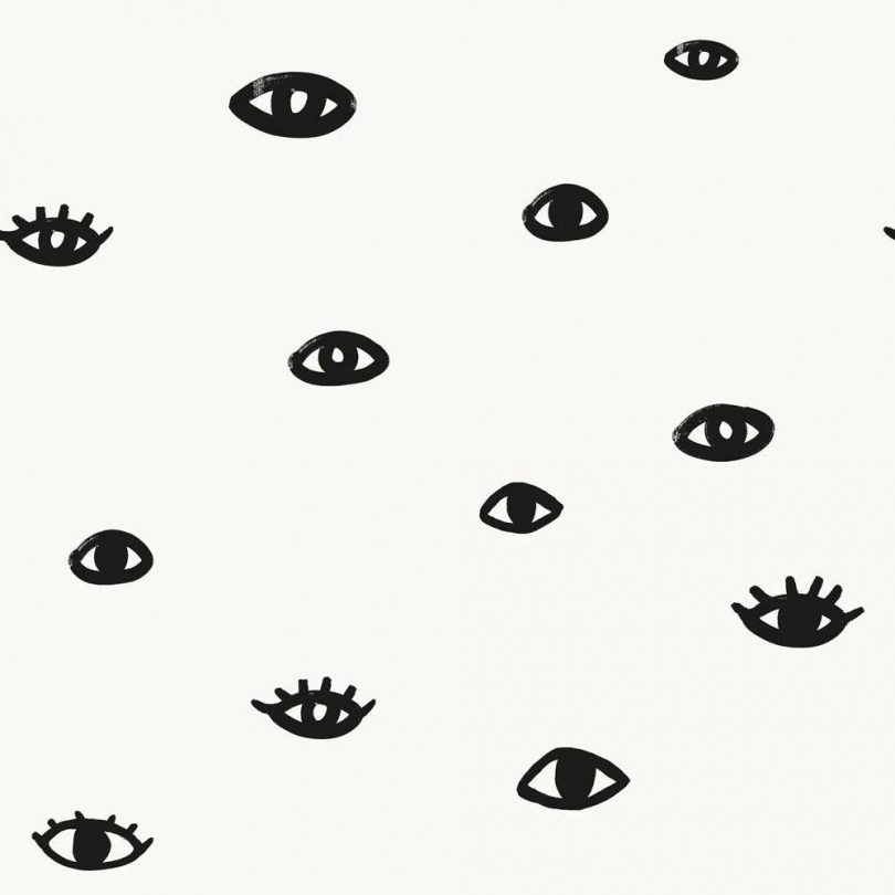 wallpaper with hand-painted black eyes on white background
