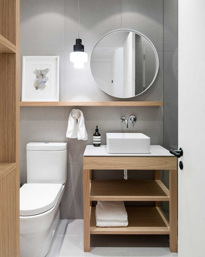 modern bathroom with wood and white fixtures