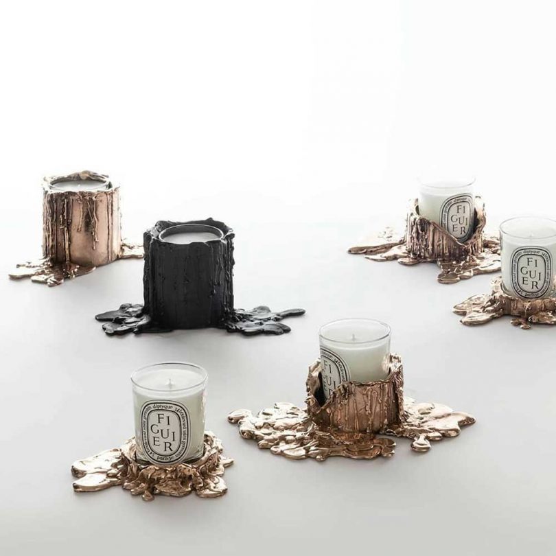 collection of Diptyque candles with melting metal bases