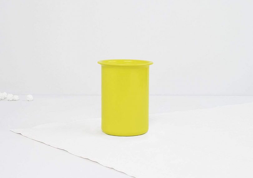 ayasa aluminum and wood jar in yellow on a white background