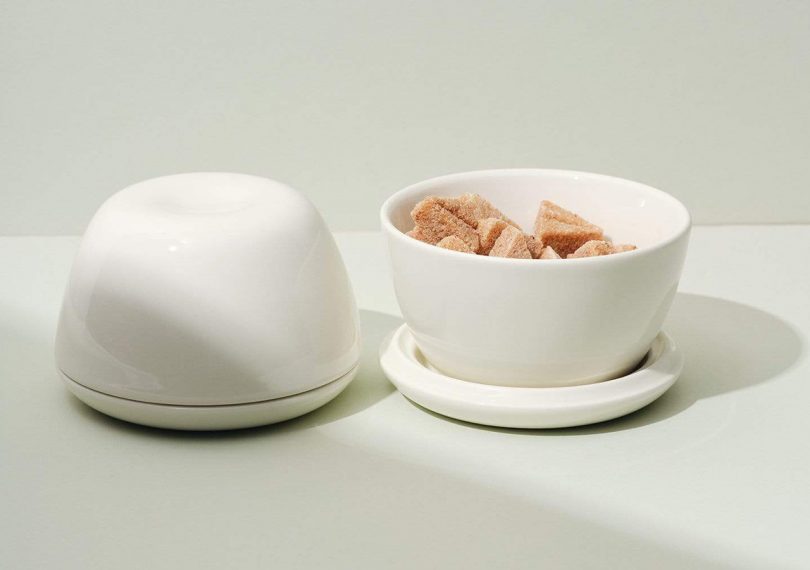 Fors Studio Switch Bowls on a light grey surface. One is full of sugar cubes and the other is flipped as a dome covered dish