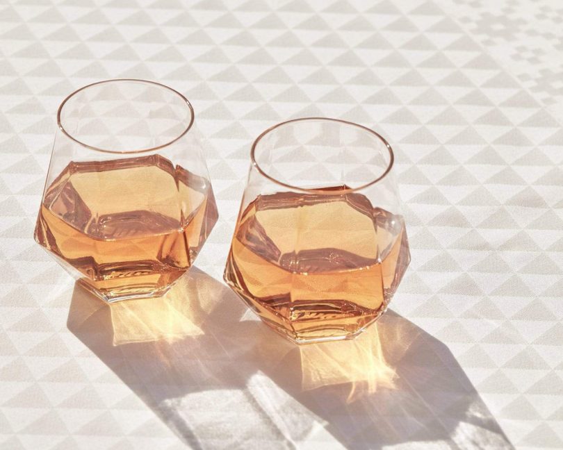 radiant water glasses by puik design on a triangle patterned table top