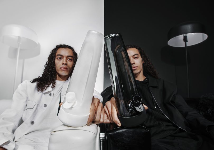 identical models holding session goods designer series water pipes in white (left) and black (right)
