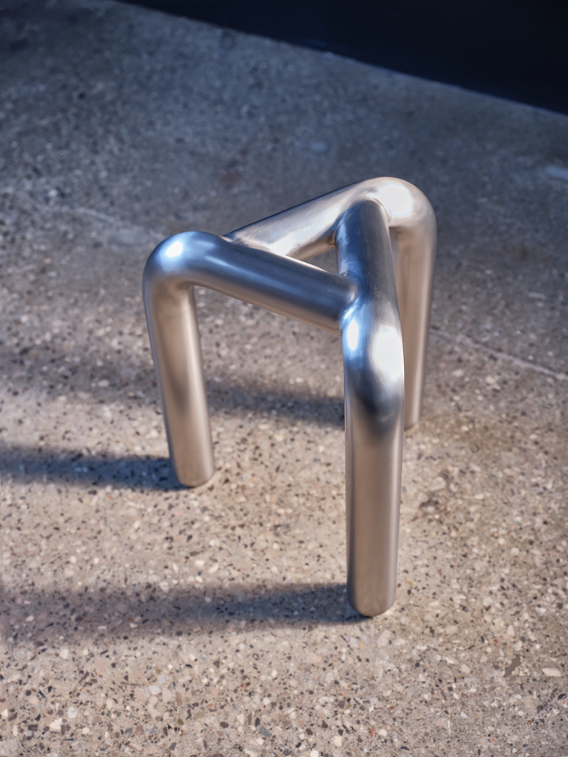 three legged silver stool