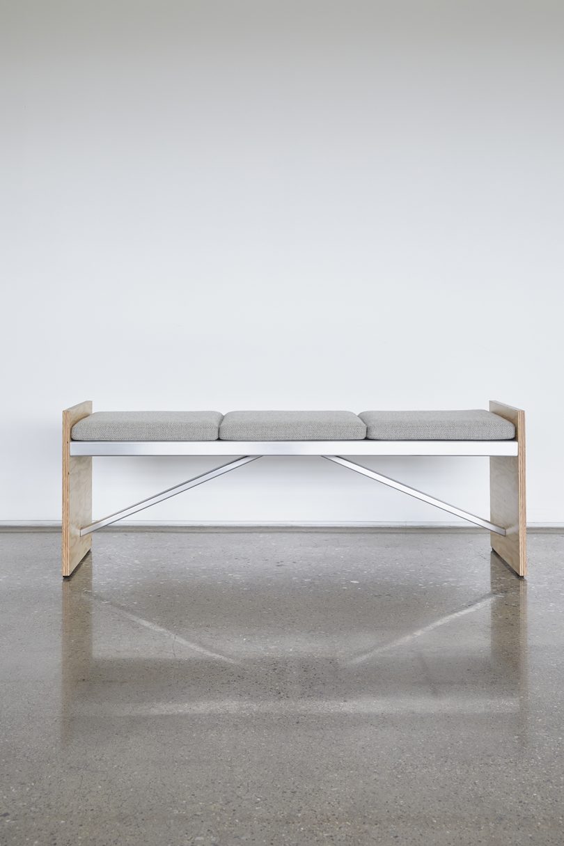 metal and wood bench on concrete floor