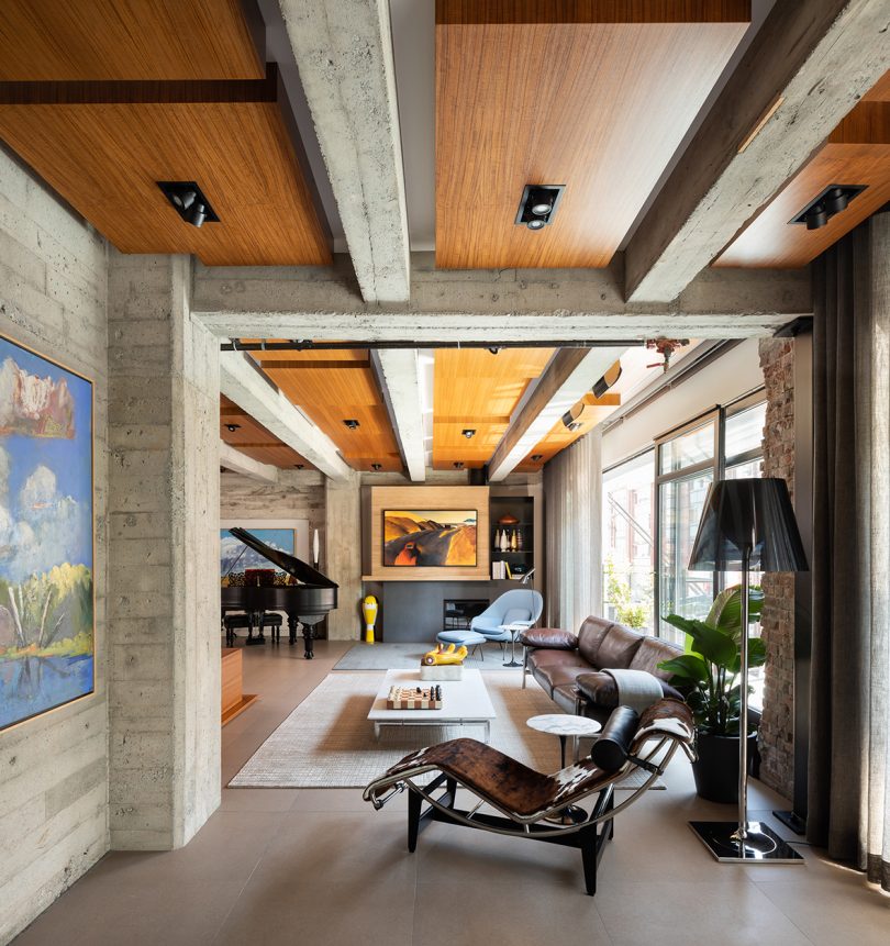 interior space with white ceiling beams and lots of windows