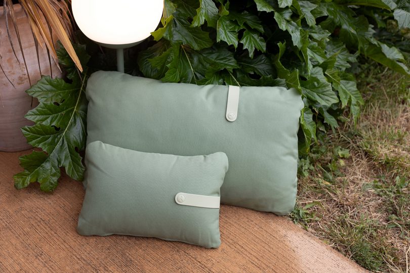 two sage green pillows