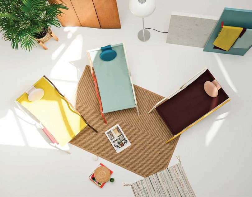 overhead photo of three colorful geometric slingback chairs