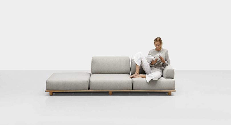 outdoor sofa with seated woman on white background
