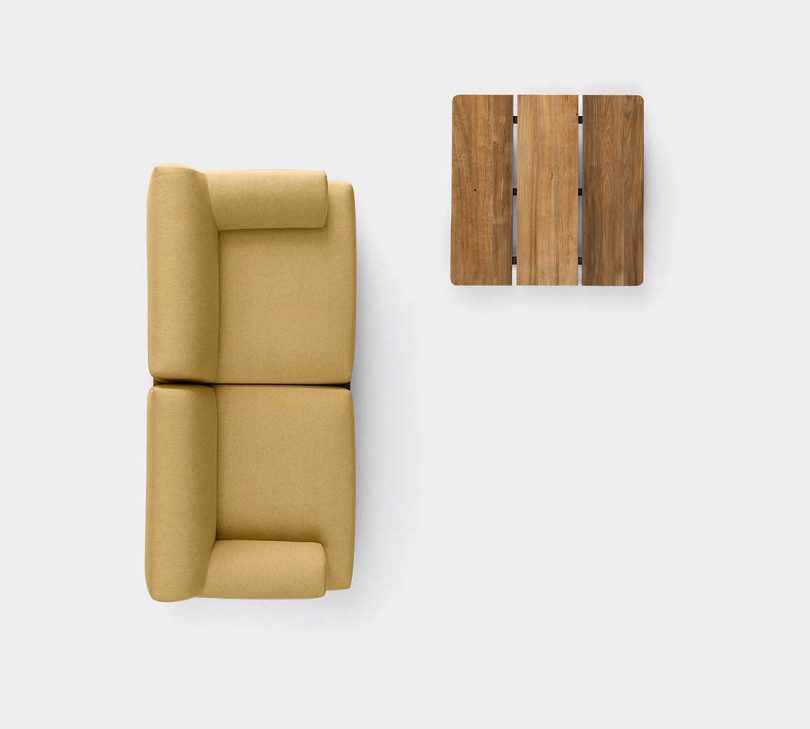 overhead photo of wooden sofa base and two seater sofa