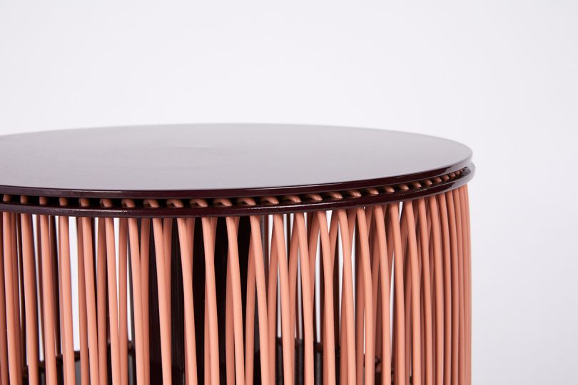 detail of fringed side table on white background
