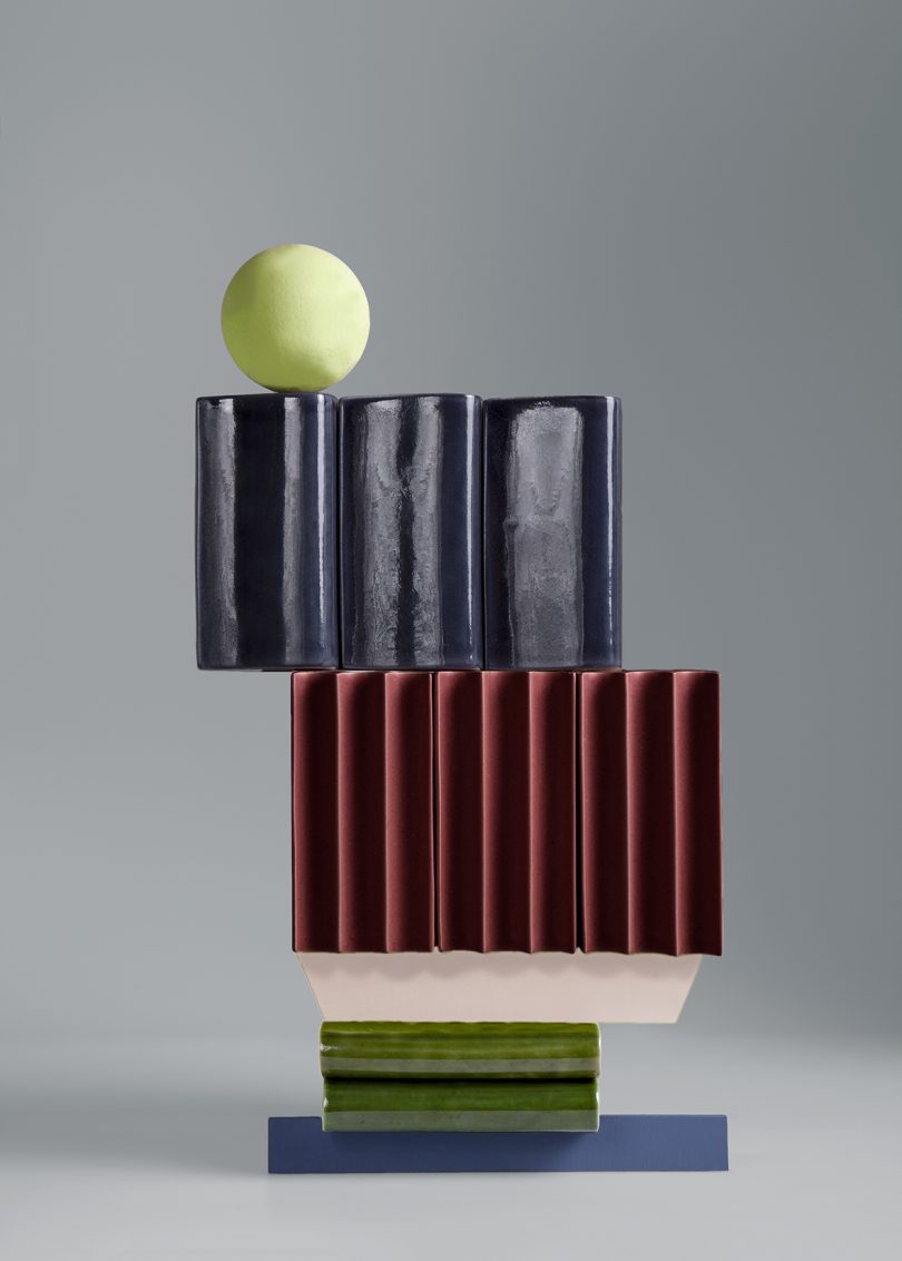 tower of stacked tiles with tennis ball on top